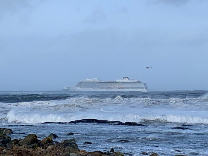 The cruise ship Viking Sky is pictured on March 23, 2019 near the west coast of Norway at Hustadvika near Romsdal. – Emergency services said on March 23, 2019 they were airlifting 1,300 passengers off a cruise ship off the Norwegian coast. The Viking Sky cruise ship sent an SOS message due to 