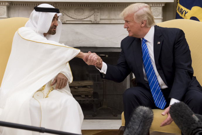 US President Donald Trump shakes hands with Crown Prince Mohammed Bin Zayed Al Nahyan of Abu Dhabi during a meeting in the Oval Office of the White House in Washington, DC, May 15, 2017. (Photo by SAUL LOEB / AFP)