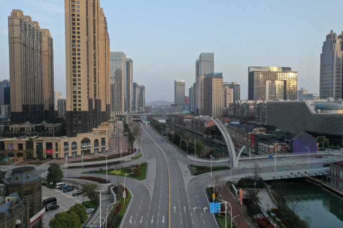 This aerial photo taken on March 10, 2020 shows an empty street in Wuhan in China's central Hubei province. – China said on March 10 the epicentre of the new coronavirus outbreak Hubei would relax travel restrictions to allow healthy people to move within the hard-hit province. (Photo by STR / AFP) / China OUT