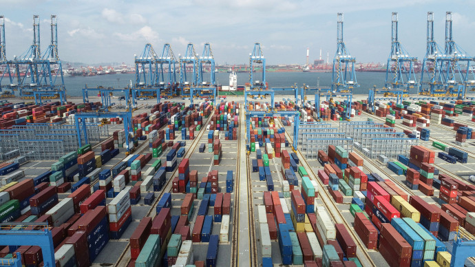This aerial photo taken on September 13, 2020 shows shipping containers stacked at a port in Qingdao in China's eastern Shandong province. (Photo by AFP) / China OUT
