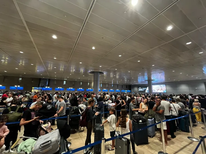 Our reader's photo of passengers waiting at Tel Aviv Airport