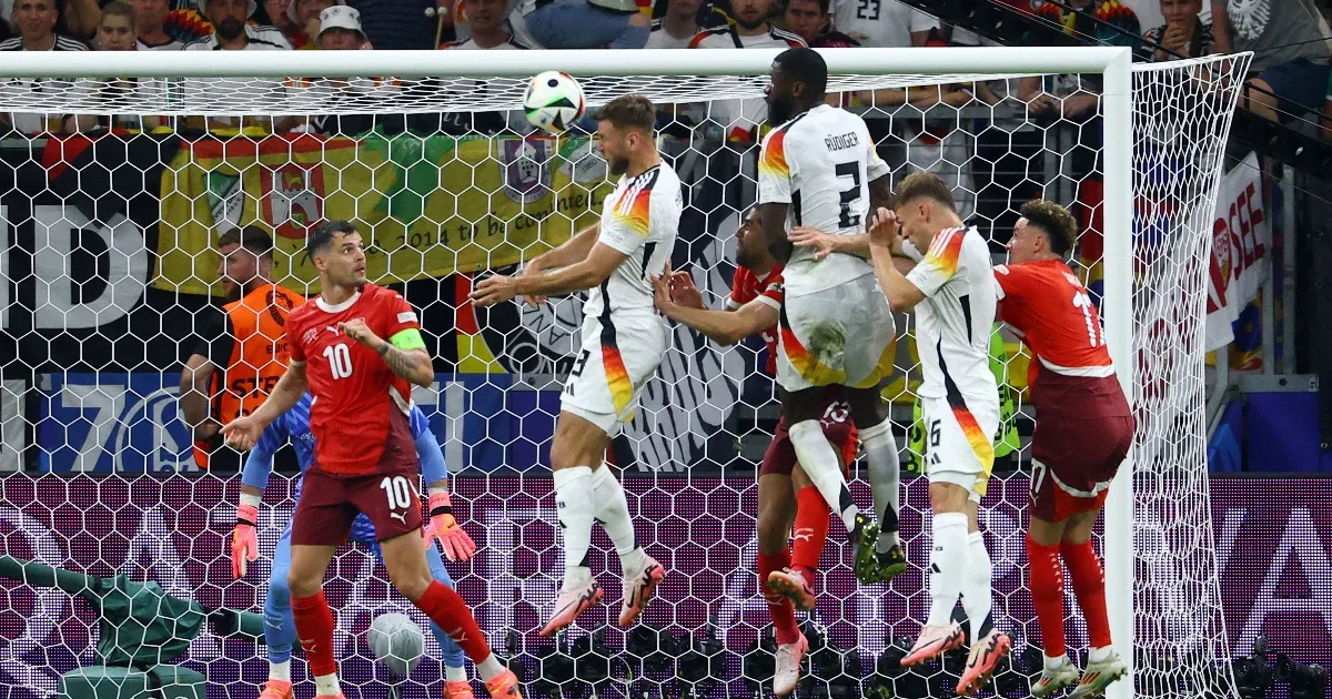 Germany saved the group lead with a aim within the 92nd minute