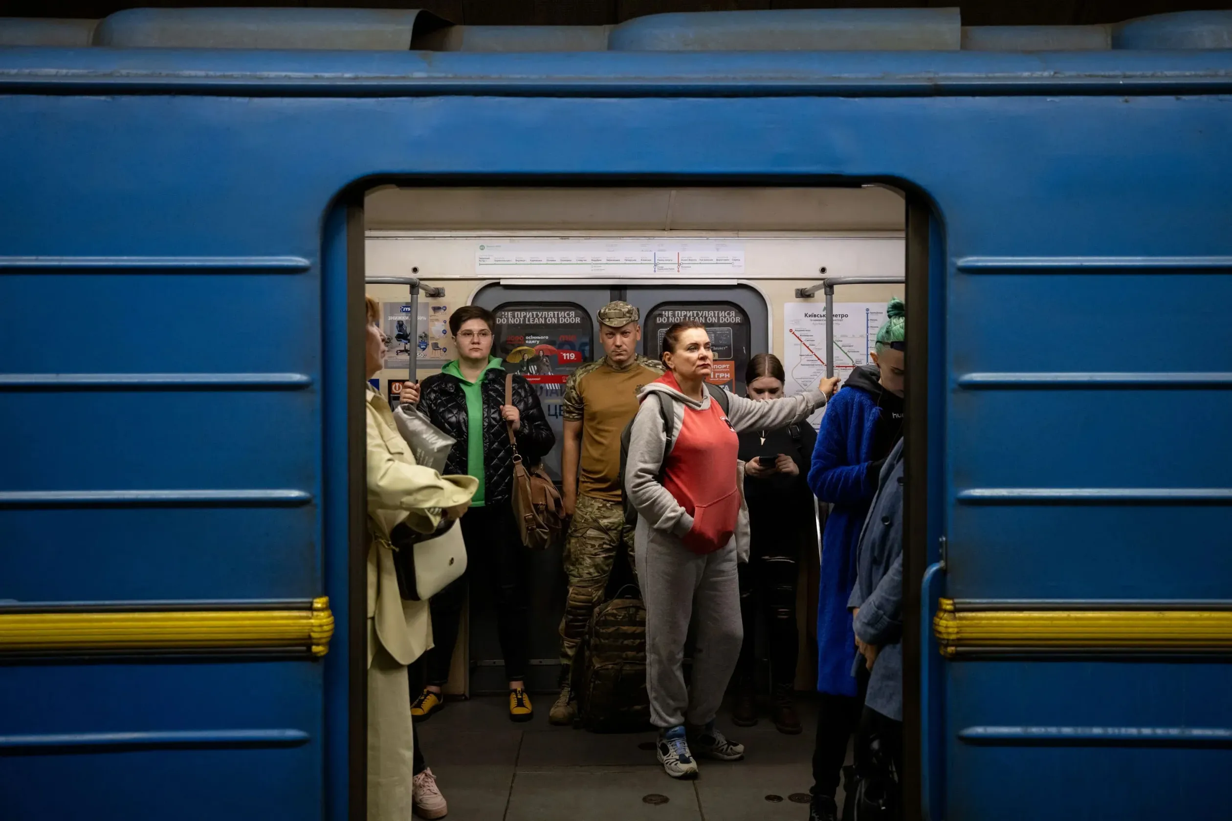 A Ukrainian soldier on the Kyiv metro. Some 3,600 Ukrainian POWs and deported citizens have been returned to Ukraine through regular prisoner exchanges between Moscow and Kyiv, but thousands more may still be in Russian hands, according to the Ukrainian Defence Ministry – Photo by Orsi Ajpek / Telex