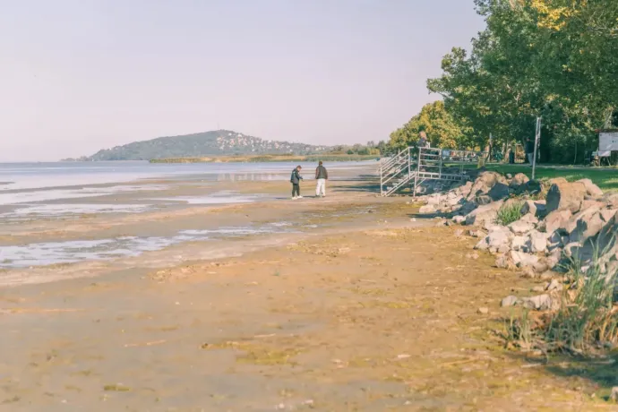 The water level of Lake Balaton is so low that people are walking in the lakebed