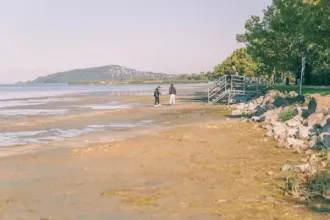 The water level of Lake Balaton is so low that people are walking in the lakebed
