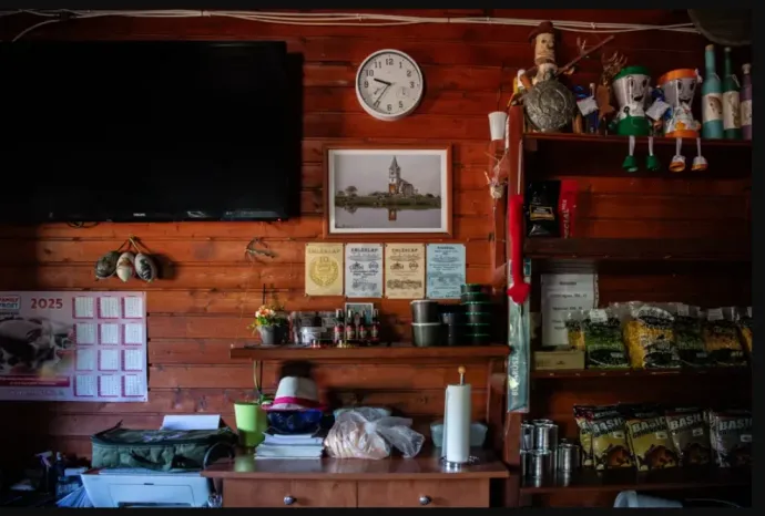 A picture of the former church on the wall of the fishing lake office – Photo: János Bődey / Telex